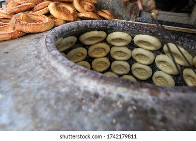 Making Naan Flat Breads In The Traditional Stove,xinjiang,china