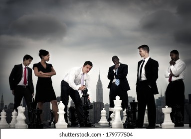 Making The Next Move: Business People Playing Chess