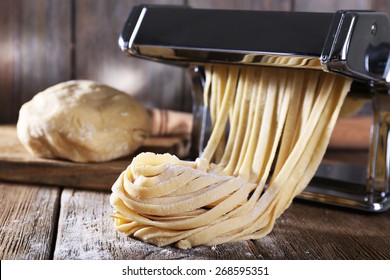 Making noodles with pasta machine - Powered by Shutterstock