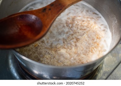 Making Oatmeal Porridge. Oats Cooking In A Pot. Healthy Breakfast.