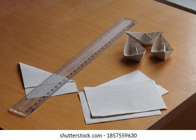 Making Paper Boat Using Scale And Paper Pieces                             