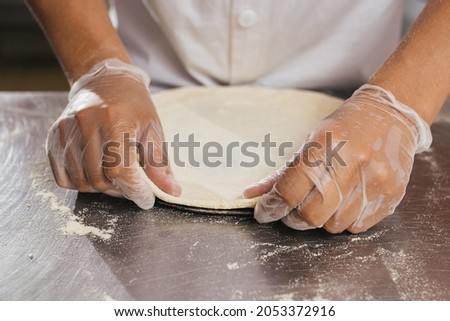 
Making pizza starting with dough
