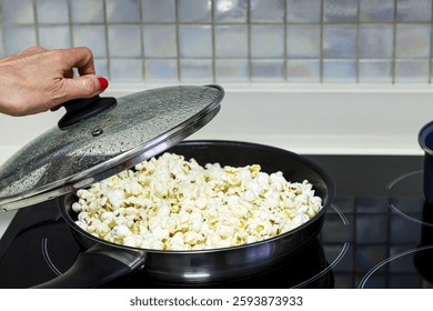 Making popcorn in a pan.