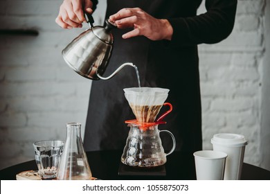 Making pour-over coffee with a hario V60 dripper - Shutterstock ID 1055875073