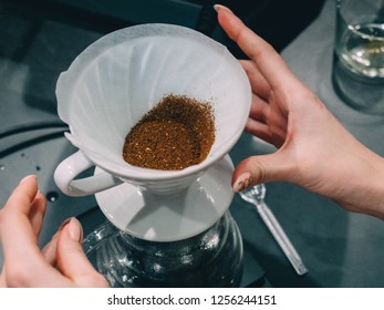 Making pour-over coffee with a hario V60 dripper. - Shutterstock ID 1256244151
