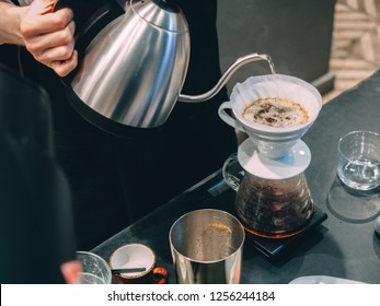 Making pour-over coffee with a hario V60 dripper. - Shutterstock ID 1256244184