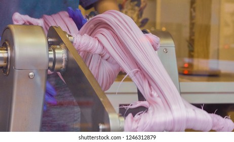 Making Purple Salt Water Taffy In Small Candy Shop.