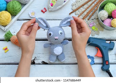 Making rabbit with carrot. Crochet bunny for child. On table threads, needles, hook, cotton yarn. Handmade crafts. DIY concept. Small business. Income from hobby. - Powered by Shutterstock