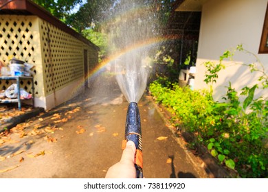 Making Rainbow By Water Spray Background