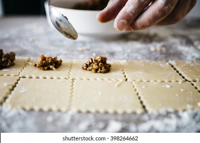 Making ravioli on a wooden table and tools - Powered by Shutterstock