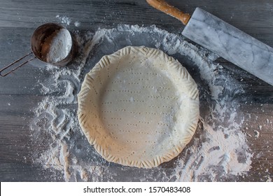 Making Rustic Pastry Dough Pie Shell On Floured Surface With Rolling Pin Flat Lay