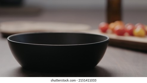 Making Salad With Kale, And Cherry Tomatoes In Black Bowl On Concrete Countertop, Wide Photo