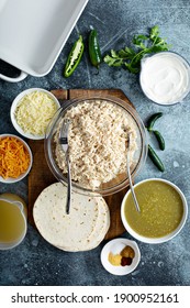 Making Salsa Verde Enchiladas With Shredded Chicken