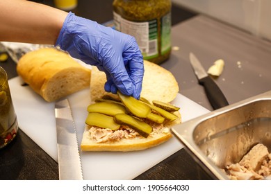 Making Sandwich In Blue Gloves