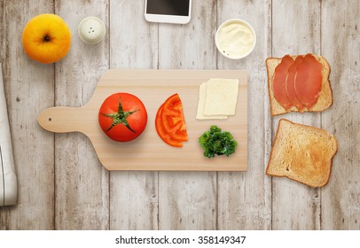 Making Sandwich On Cutting Board At Breakfast Time Top View.