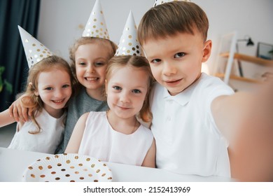Making selfie. Celebrating brithday. Group of children is together at home at daytime.