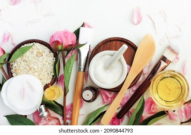 
Making skin care beauty treatment plant based products, top view homemade cosmetic ingredients pink peony petals. Botanical therapy moisturizer jar, herbal recipe essential oils, nourishing face mask - Shutterstock ID 2090844793