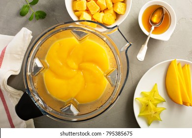 Making Smoothie With Frozen Mango And Honey, Blender Top View