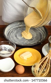 Making Sour Cream Lemon Cake. Pouring Cake Batter Into Baking Tin.