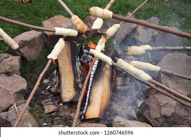 Making stick bread around the campfire