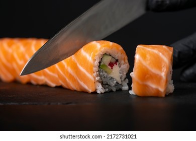 Making sushi and rolls at home. Close Up of a man’s hand - Shutterstock ID 2172731021