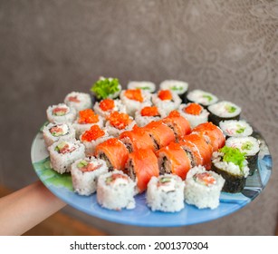 Making Sushi And Rolls At Home. Sushi With Seafood, Salad And White Rice. Food For Family And Friends. A Set Of Different Rolls And Sushi On A Tray.