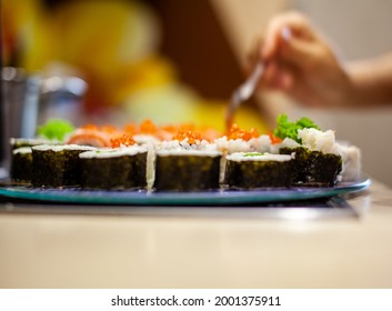 Making Sushi And Rolls At Home. Sushi With Seafood, Salad And White Rice. Food For Family And Friends. A Set Of Different Rolls And Sushi On A Tray.