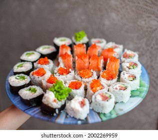 Making Sushi And Rolls At Home. Sushi With Seafood, Salad And White Rice. Food For Family And Friends. A Set Of Different Rolls And Sushi On A Tray.