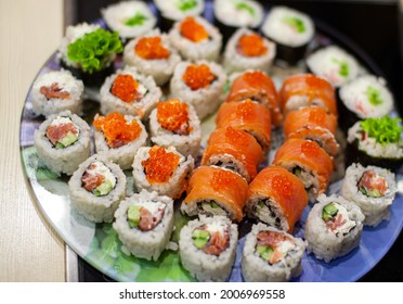 Making Sushi And Rolls At Home. Sushi With Seafood, Salad And White Rice. Food For Family And Friends. A Set Of Different Rolls And Sushi On A Tray.