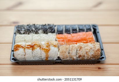 Making Sushi And Rolls At Home. Sushi With Seafood, Salad And White Rice. Food For Family And Friends. A Set Of Different Rolls And Sushi On A Tray.