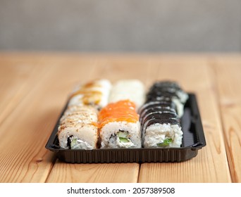 Making Sushi And Rolls At Home. Sushi With Seafood, Salad And White Rice. Food For Family And Friends. A Set Of Different Rolls And Sushi On A Tray.