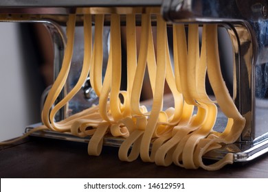 Making tagliatelle with a traditional pasta machine - Powered by Shutterstock