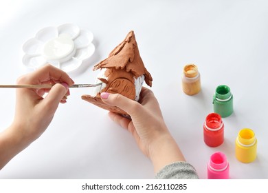 Making Toys With Your Own Hands, Paints A Clay House With Gouache. Indoors Creative Leisure For Children. Supporting Creativity, Learning By Doing, DIY Project, Hand Craft. Master Class Of Art