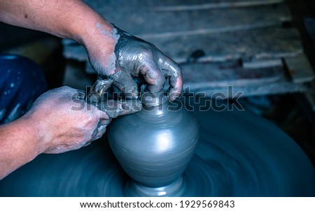 making traditional method handmade clay pottery pot at Bhaktapur, Nepal.