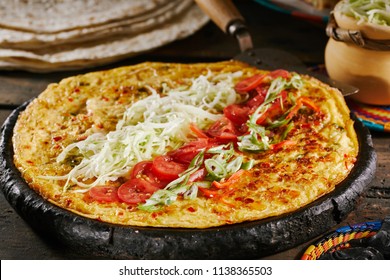 Making Traditional Rolex Rolls African Street Food With Egg Omelette Topped With Diced Fresh Tomatoes And Cabbage On A Chapati Flatbread Ready To Be Rolled