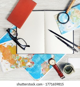 Making travel plan. Map, blank book, magnifier, glasses, notebook, pencils, clock and money. Top view. Flat lay. - Powered by Shutterstock