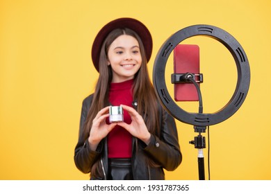 making video blog on phone. blogging ring lamp. weblog and vlog. makeup tutorial. influencer. happy teen girl use selfie led. kid beauty blogger. cheerful child do makeup. vlogger with cosmetics.