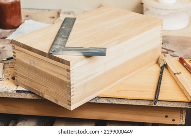 Making a wooden box in carpentry workshop - Shutterstock ID 2199000449