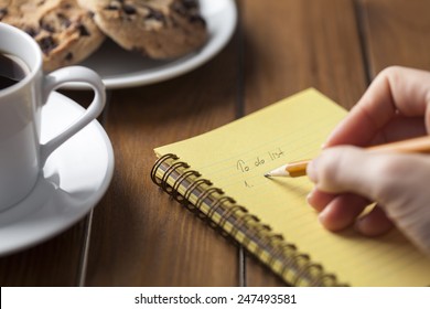 Making Your List While Having A Cup Of Coffee