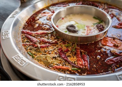 Mala Seasoning Spicy Chinese Hotpot. Hotpot Is An Interactive Meal In Which Diners Sit Around A Simmering Pot Of Soup At The Center Of The Table With Ingredients.