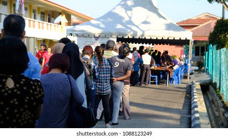 Malacca, Malaysia: 09/05/2018; Crowds Queuiup Patiently In Malacca, Malaysia To Cast Tbeir Votes During 14th Malaysian General Election Day.