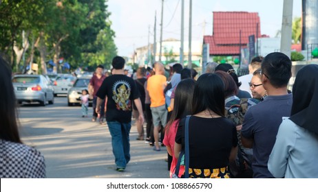 Malacca, Malaysia: 09/05/2018; Crowds Queuiup Patiently In Malacca, Malaysia To Cast Tbeir Votes During 14th Malaysian General Election Day.