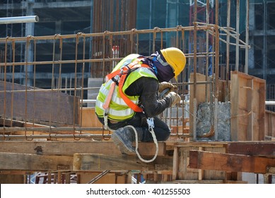 MALACCA, MALAYSIA -OCTOBER 13, 2015: Construction workers fabricating steel reinforcement bar at the construction site in Malacca, Malaysia - Shutterstock ID 401255503