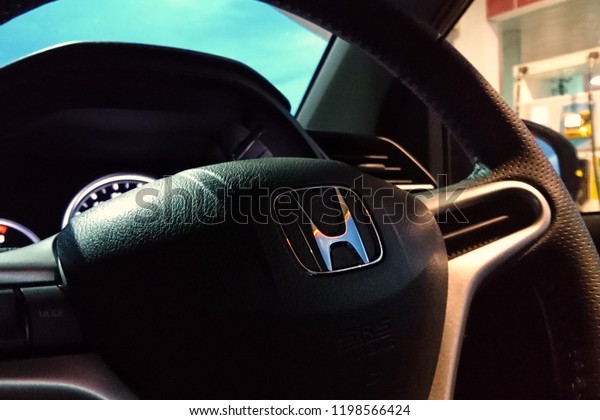 MALACCA, MALAYSIA - OCTOBER 9, 2018 : View of\
HONDA steering and meter. Focus on HONDA logo, Black Steering Wheel\
And Silver, editorial honda brv.\
