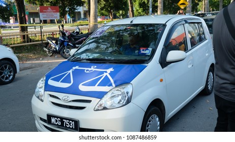 Malacca,Malaysia; 09/05/2018; Car With National Front Flag Campaigning For 14th Malaysian General Election In Malacca Malaysia On 09/05/2018. 