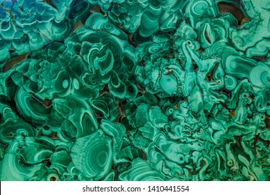 Malachite green mineral gemstone texture,malachite background, green background. Amazing polished natural slab of green malachite mineral gemstone specimen gemstone macro as a background