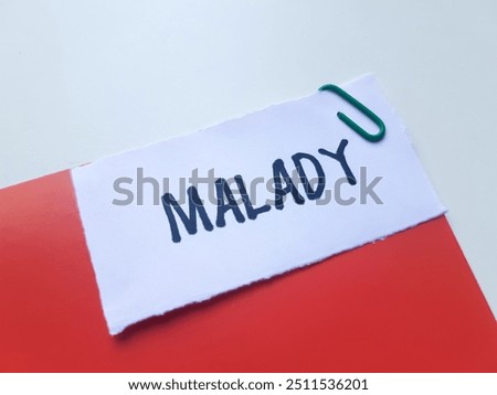 Malady writting on table background.