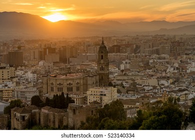 Malaga City At Sunset