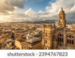 Malaga cityscape with beautiful Cathedral of the incarnation at sunset, Spain. Malaga old town, Cathedral and skyline of the city.
