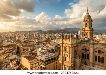 Malaga cityscape with beautiful Cathedral of the incarnation at sunset, Spain. Malaga old town, Cathedral and skyline of the city.
